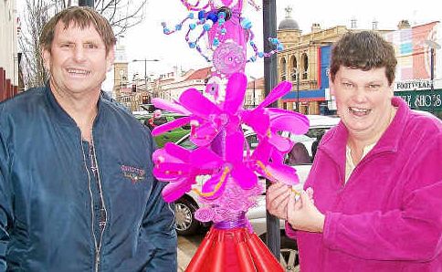 Recycladelic rainbow tree: Blue Care Cooinda Group’s Michael Craig and Megan Ballard. Recycladelic rainbow tree: Blue Care Cooinda Group’s Michael Craig and Megan Ballard.
